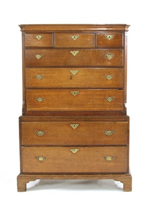 Lot 664 - An 18th century oak chest on chest