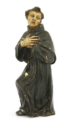 Lot 186 - An early Spanish carved wood religious figure of a monk