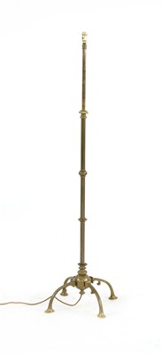 Lot 599 - An Arts & Crafts brass standard lamp