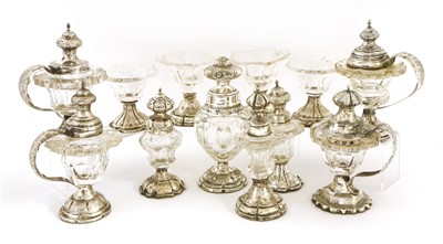 Lot 102 - A matched set of twelve Dutch white metal and cut-glass condiments