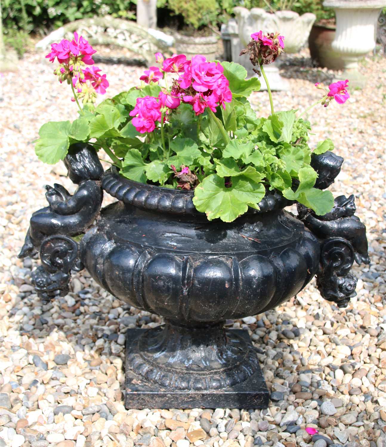 Lot 287 - A black painted cast iron garden urn
