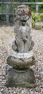 Lot 750 - A pair of composition stone heraldic lions