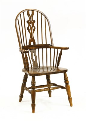 Lot 648 - An oak Windsor open armchair