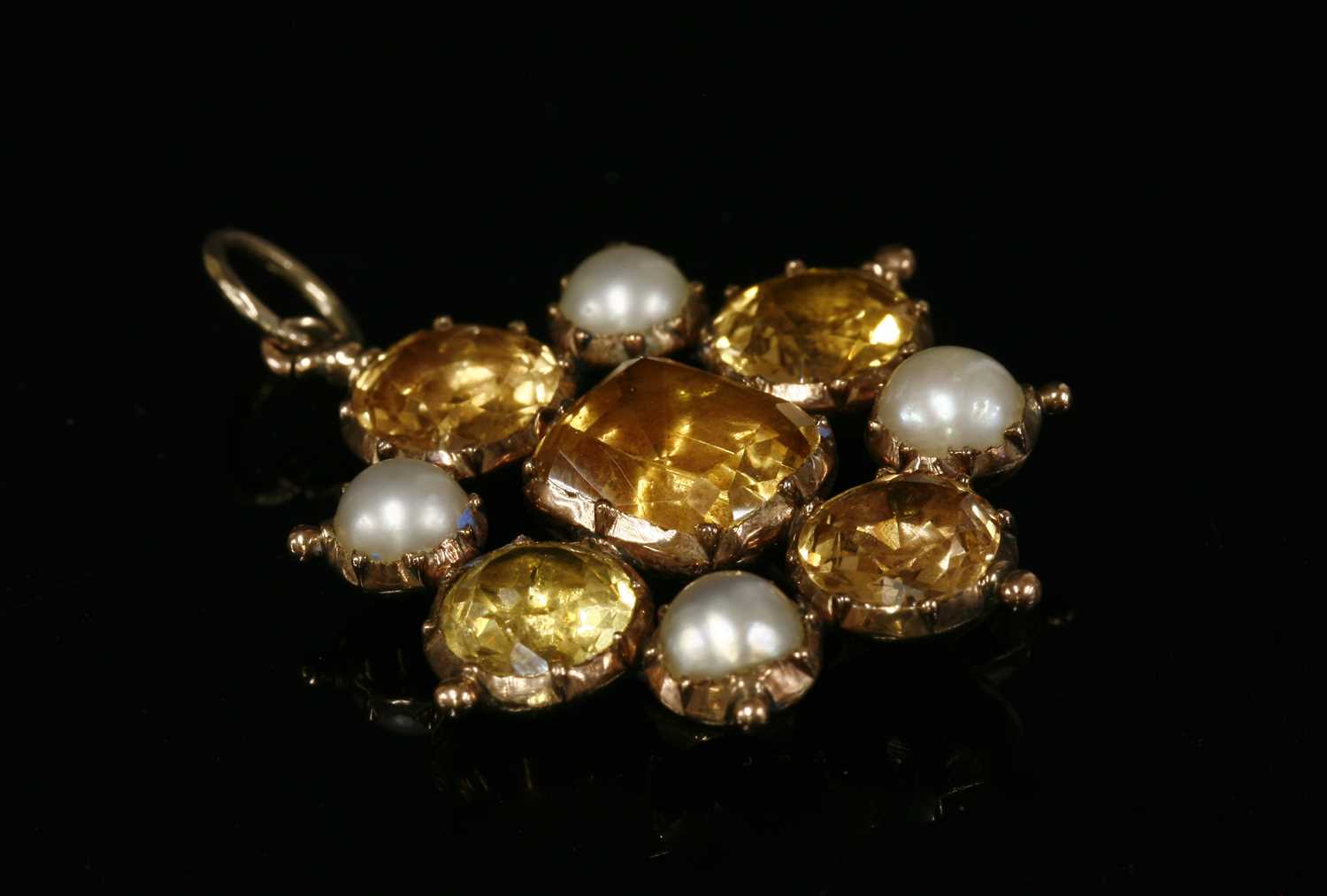Lot 7 - A Georgian gold topaz, split pearl and paste pendant