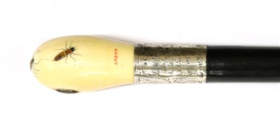 Lot 396 - A Japanese ivory and ebonised wood walking stick