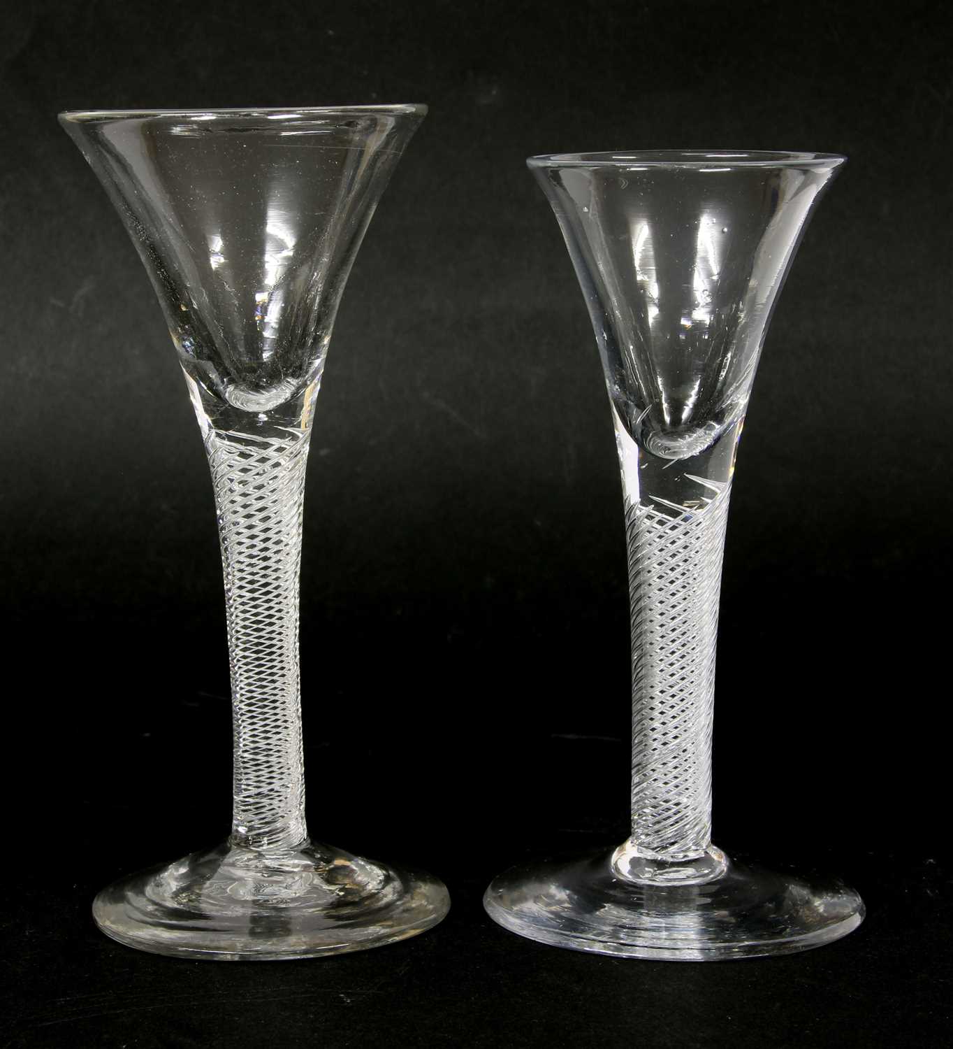 Lot 194 - Two Georgian glass air twist wine glasses