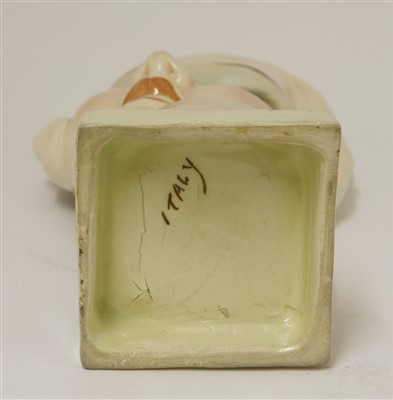 Lot 229 - An Art Deco pottery mask of a girl
