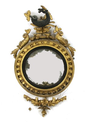 Lot 519 - A Regency convex wall mirror