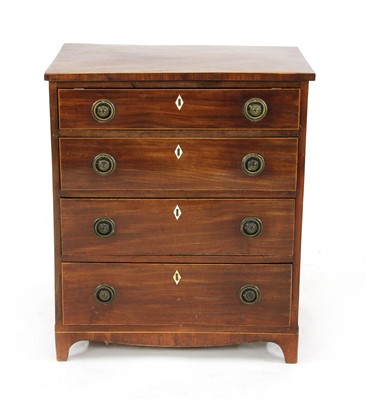 Lot 666 - A small mahogany chest of four drawers