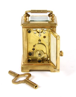 Lot 116 - A miniature brass carriage clock