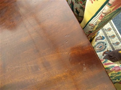 Lot 800 - A George III-style mahogany triple pillar dining table