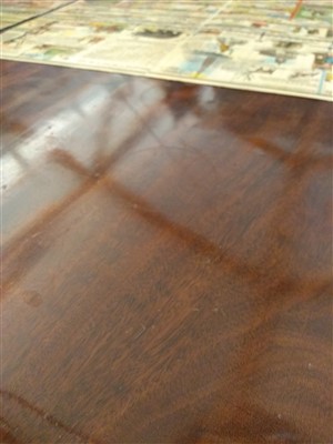 Lot 800 - A George III-style mahogany triple pillar dining table