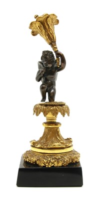 Lot 433 - A 19th century bronze figure of a cherub holding a flower