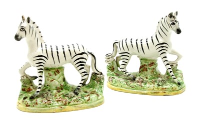 Lot 119 - A pair of Staffordshire zebras
