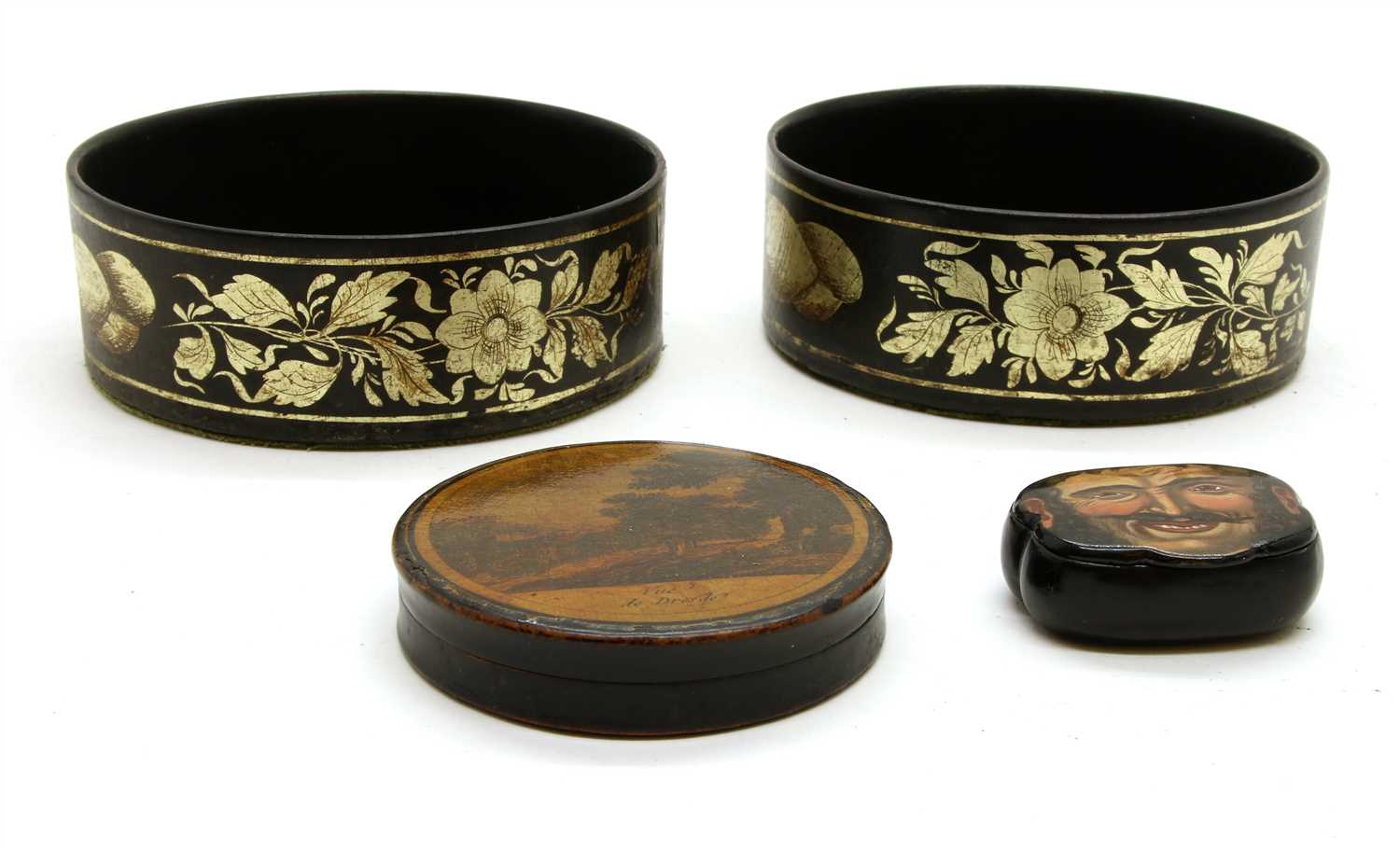 Lot 228 - A pair of circular lacquer coasters