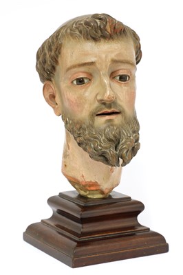 Lot 280 - A Spanish carved wood and polychrome head of a saint