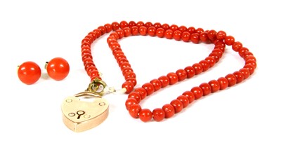 Lot 31 - A single row uniform coral bead necklace