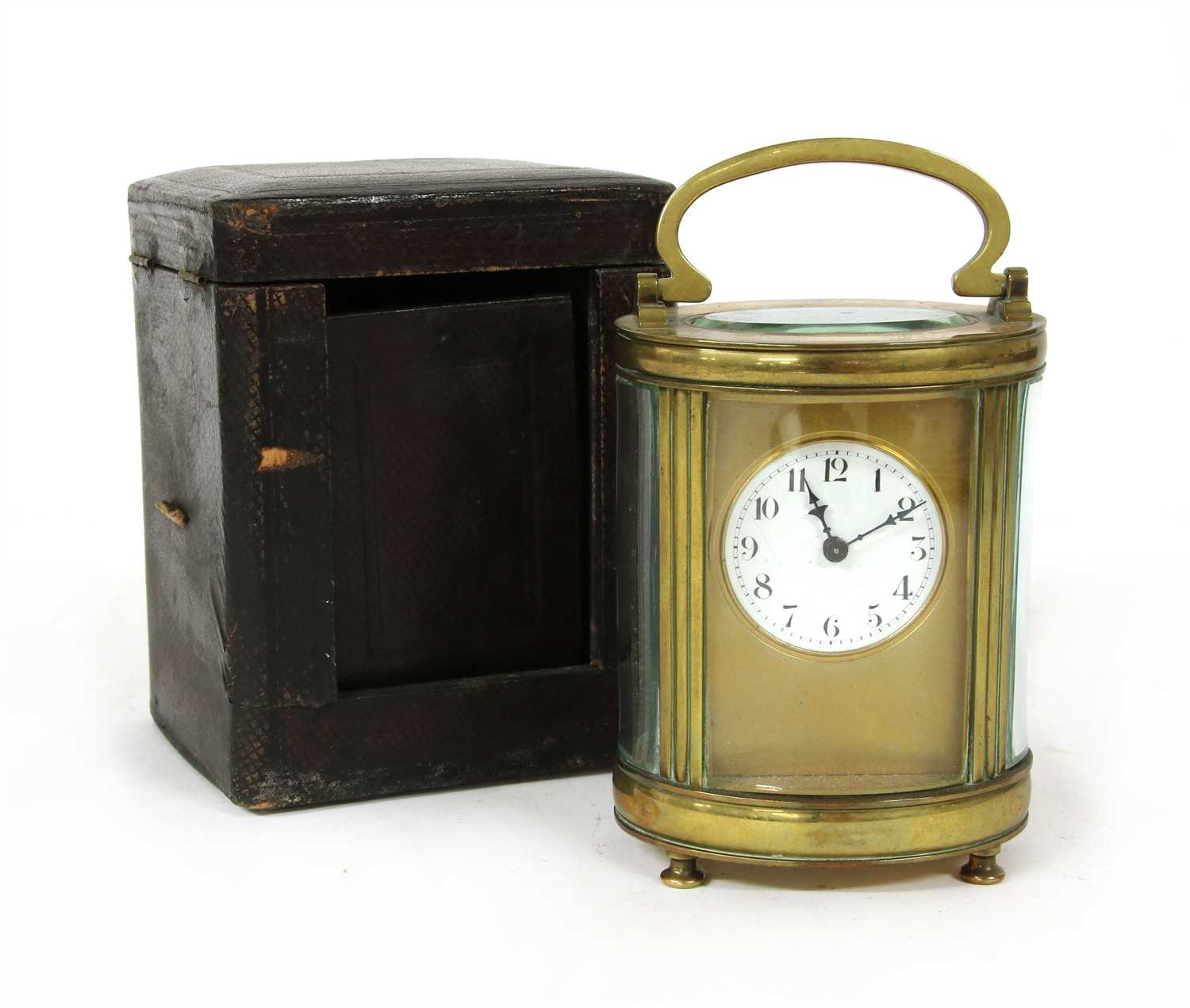 Lot 186 - An oval French brass carriage clock