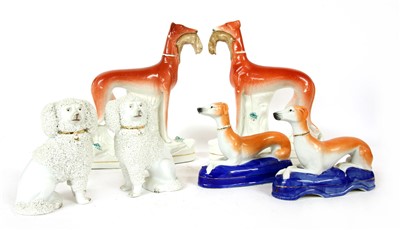 Lot 230 - A pair of Victorian Staffordshire greyhounds with rabbits