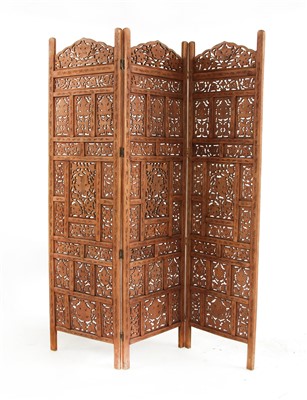 Lot 705 - A carved Anglo-Indian three fold screen