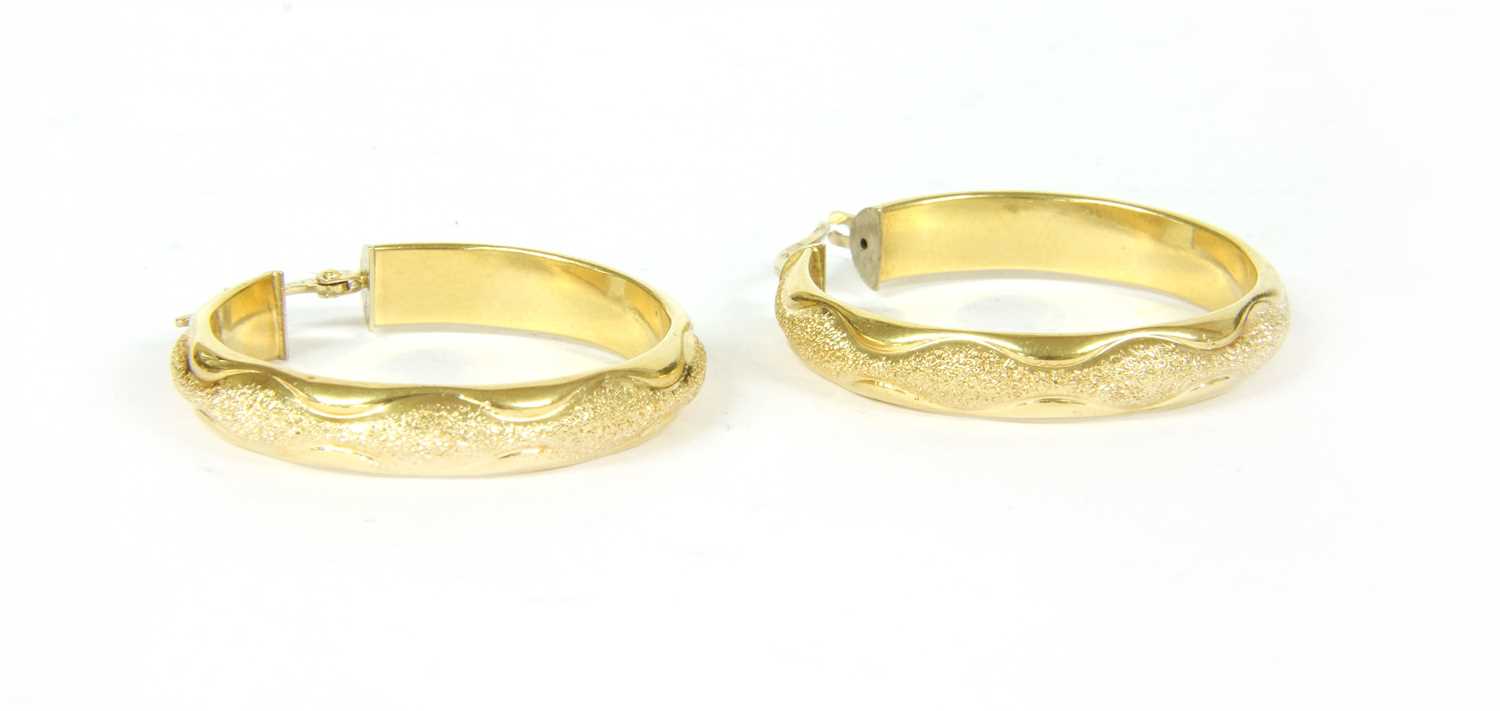 Lot 23 - A pair of gold hooped earrings