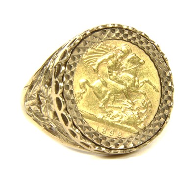 Lot 1044 - A 9ct gold ring with a half sovereign