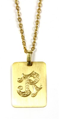 Lot 1030 - A Continental gold rectangular 'R' pendant