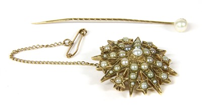 Lot 1039 - A gold cultured pearl star burst brooch