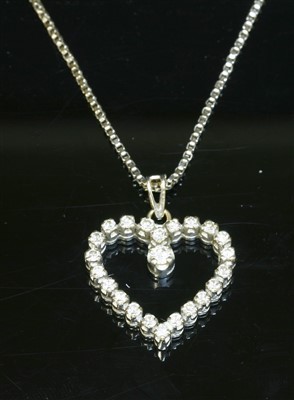 Lot 405 - A white gold diamond set heart pendant