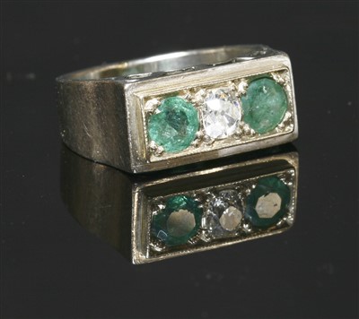 Lot 206 - A Continental diamond and emerald three stone ring, c.1940