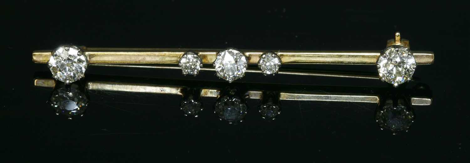 Lot 84 - A five stone diamond bar brooch