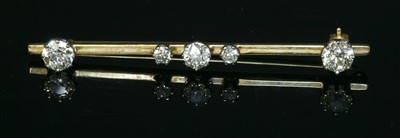 Lot 84 - A five stone diamond bar brooch