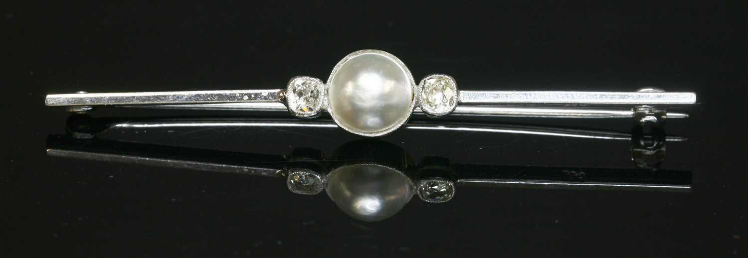 Lot 159 - A white gold cultured pearl and diamond bar brooch