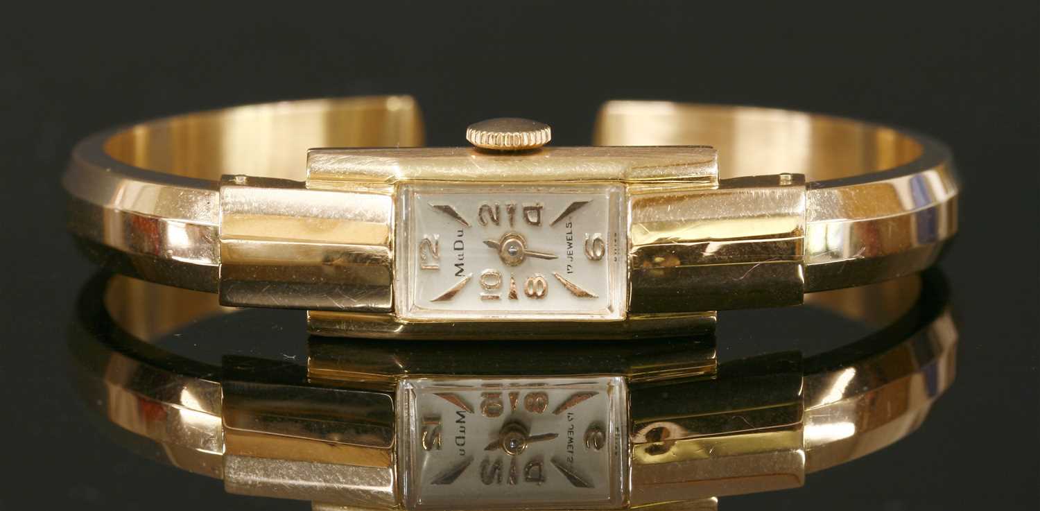 Lot 226 - A ladies' 18ct rose gold MuDu mechanical bangle watch