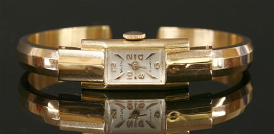Lot 226 - A ladies' 18ct rose gold MuDu mechanical bangle watch
