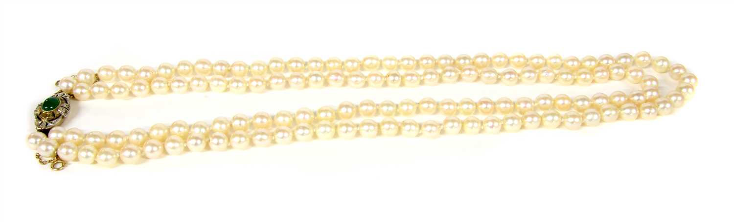 Lot 28 - A two row uniform cultured pearl necklace