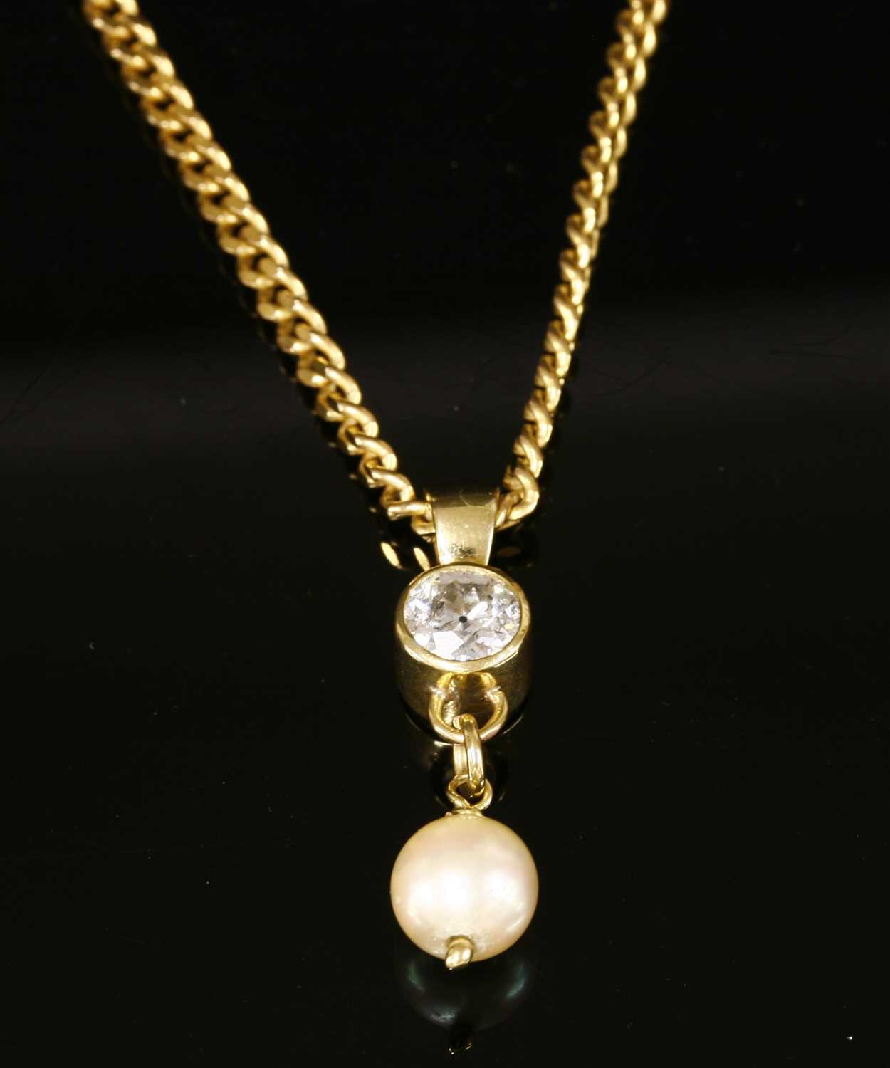 Lot 286 - A diamond and cultured pearl pendant