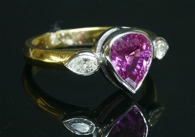 Lot 88 - An 18ct yellow and white gold three stone pink sapphire and diamond ring