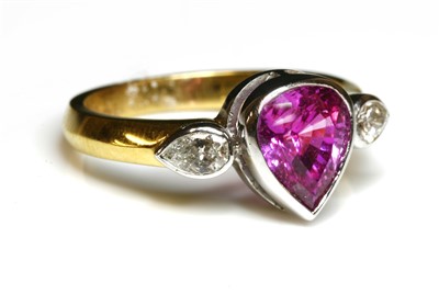 Lot 88 - An 18ct yellow and white gold three stone pink sapphire and diamond ring