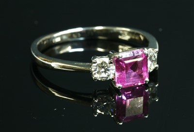 Lot 486 - An 18ct white gold three stone pink sapphire and diamond ring