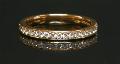Lot 415 - An 18ct rose gold half eternity ring