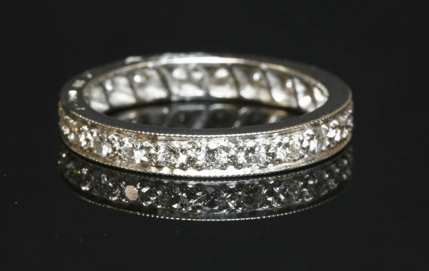 Lot 456 - A platinum diamond set full eternity ring