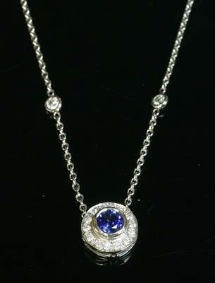 Lot 516 - A white gold sapphire and diamond cluster necklace