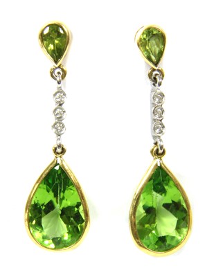 Lot 93 - A pair of 18ct yellow and white gold peridot and diamond drop earrings