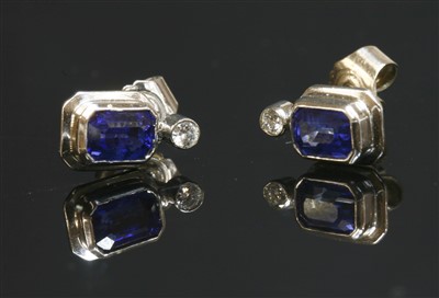 Lot 517 - A pair of 18ct white gold sapphire and diamond stud earrings