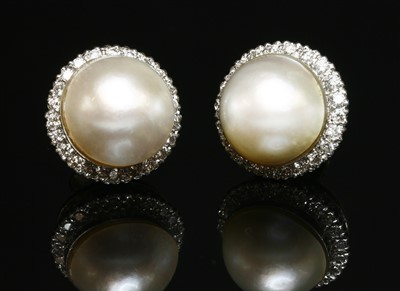 Lot 265 - A pair of 18ct white gold mabé pearl and diamond circular cluster earrings