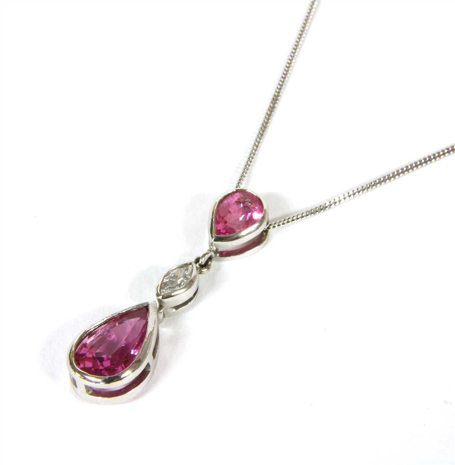 Lot 12 - An 18ct white gold pink sapphire and diamond pendant