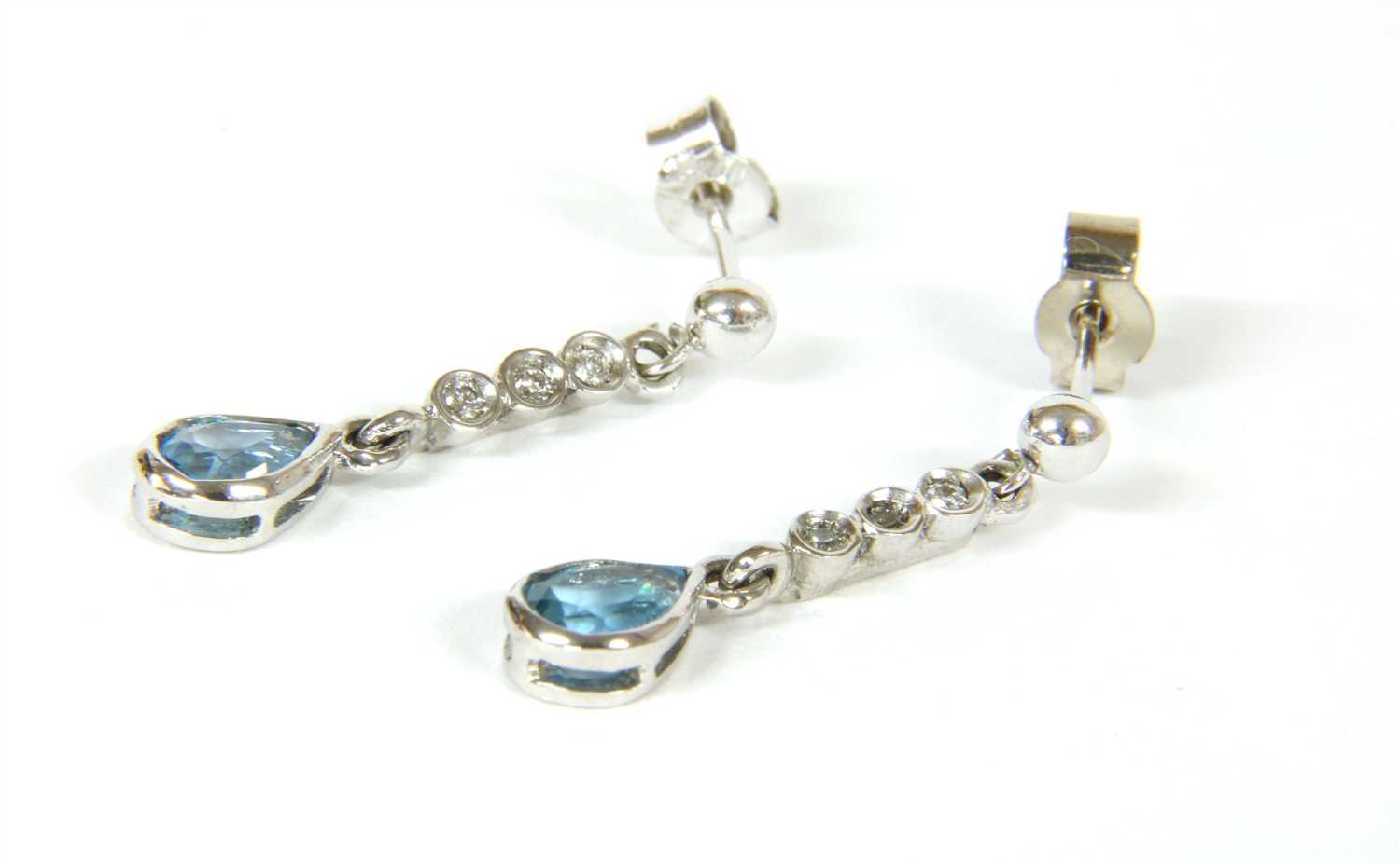 Lot 18 - A pair of white gold  blue topaz and diamond earrings