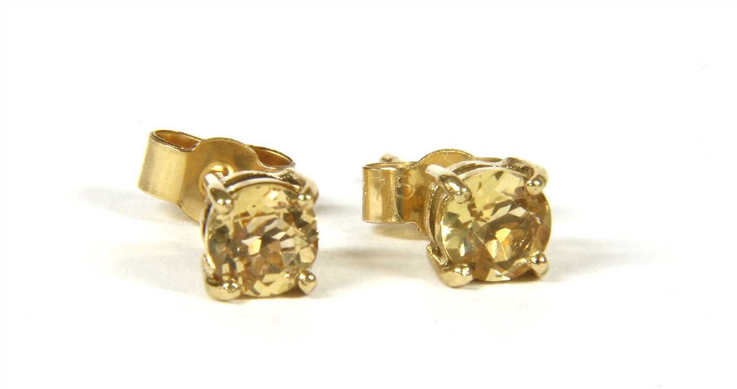 Lot 24 - A pair of gold single stone topaz stud earrings