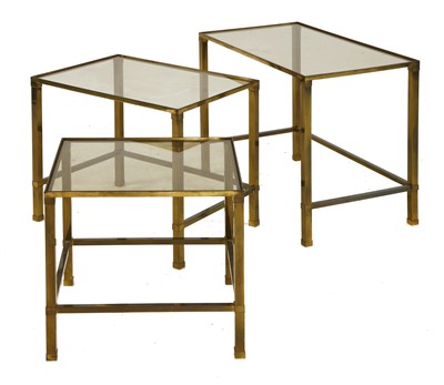 Lot 445 - A nest of three brass tables